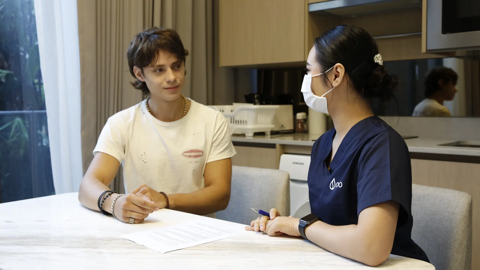 A doctor talking with a patient during a private sexual health consultation